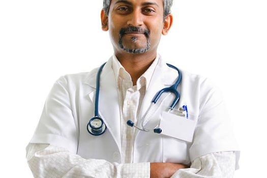 Indian mature male doctor crossed arms on white background